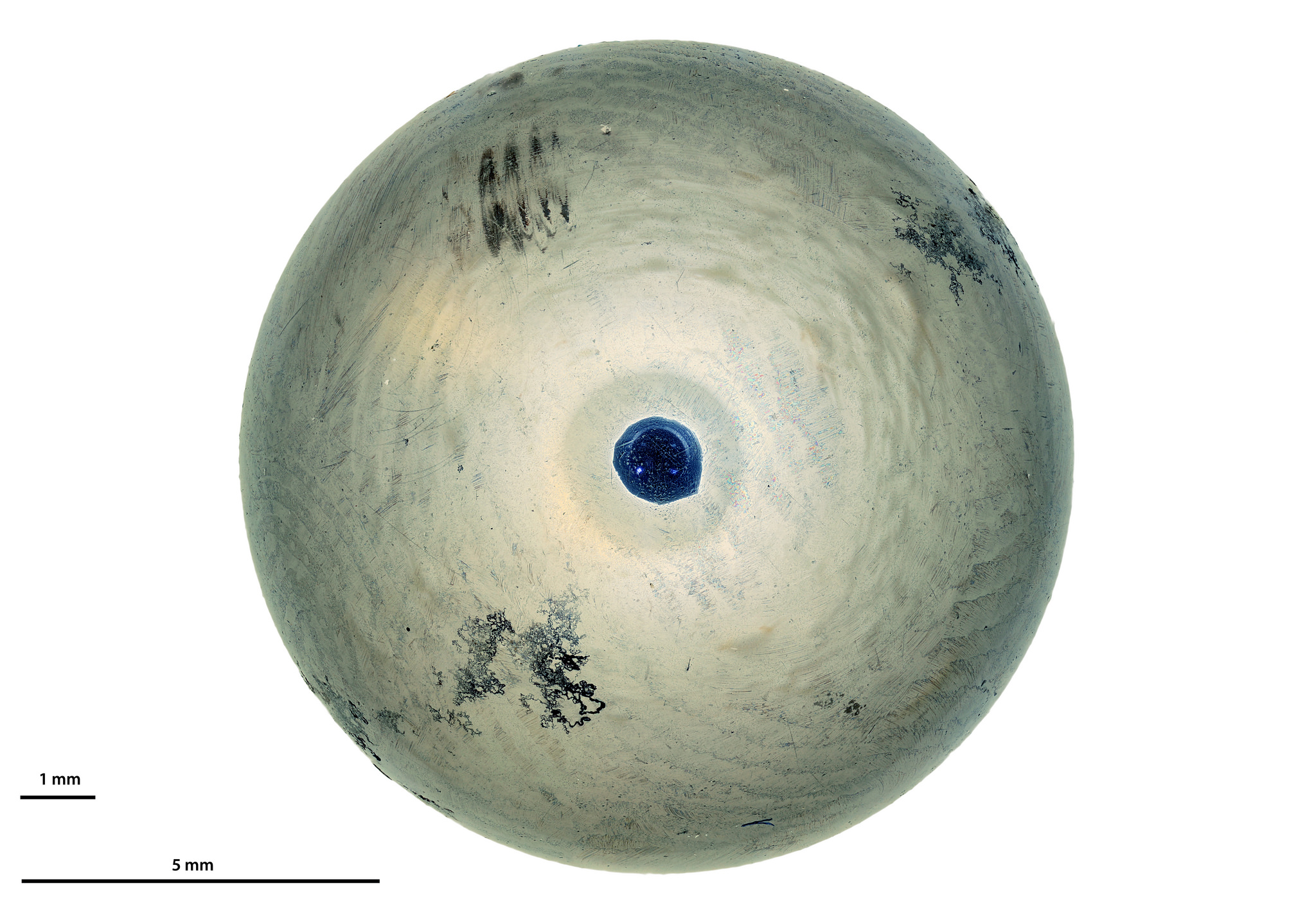 Ball Bearing shows compete cylindrical diffusion and reflects only the glass omn the objective at the very center.